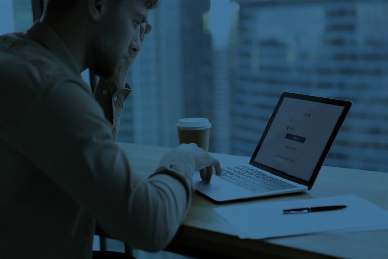 Man using laptop to enter in a form