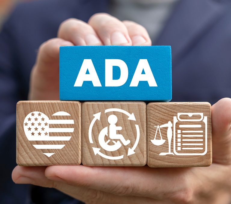 hands holding blocks that spell "ADA", web accessibility